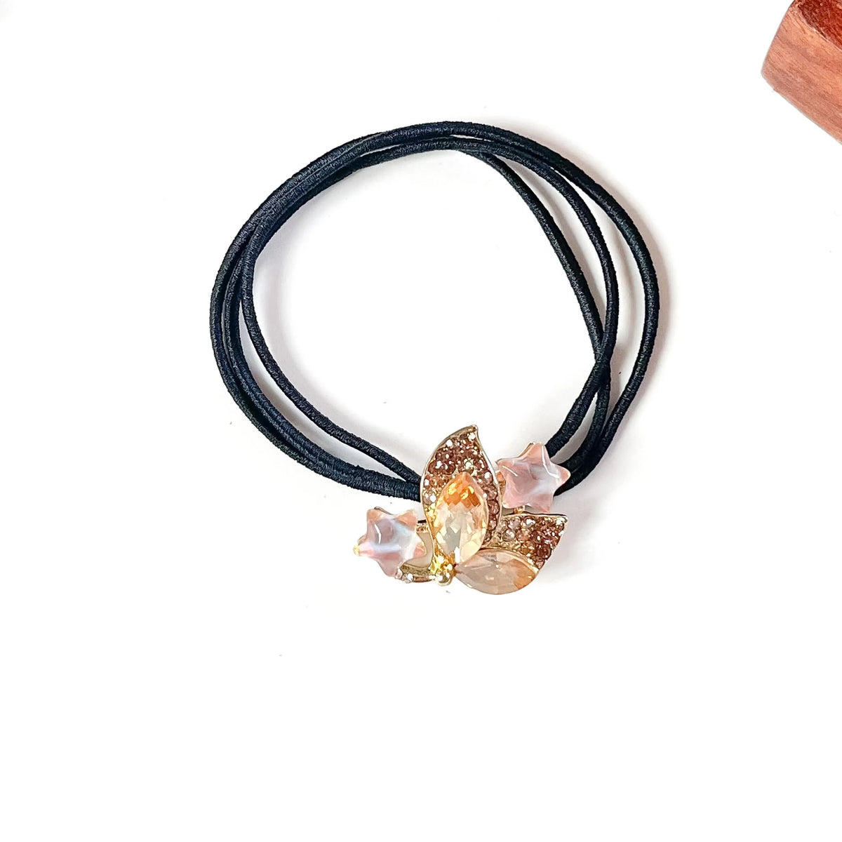 Apricot peach crystal hair tie with champagne marquise stones and pink star charms on black elastic