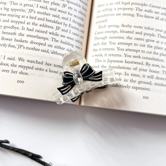 Black and clear bow hair claw clip with crystal detail