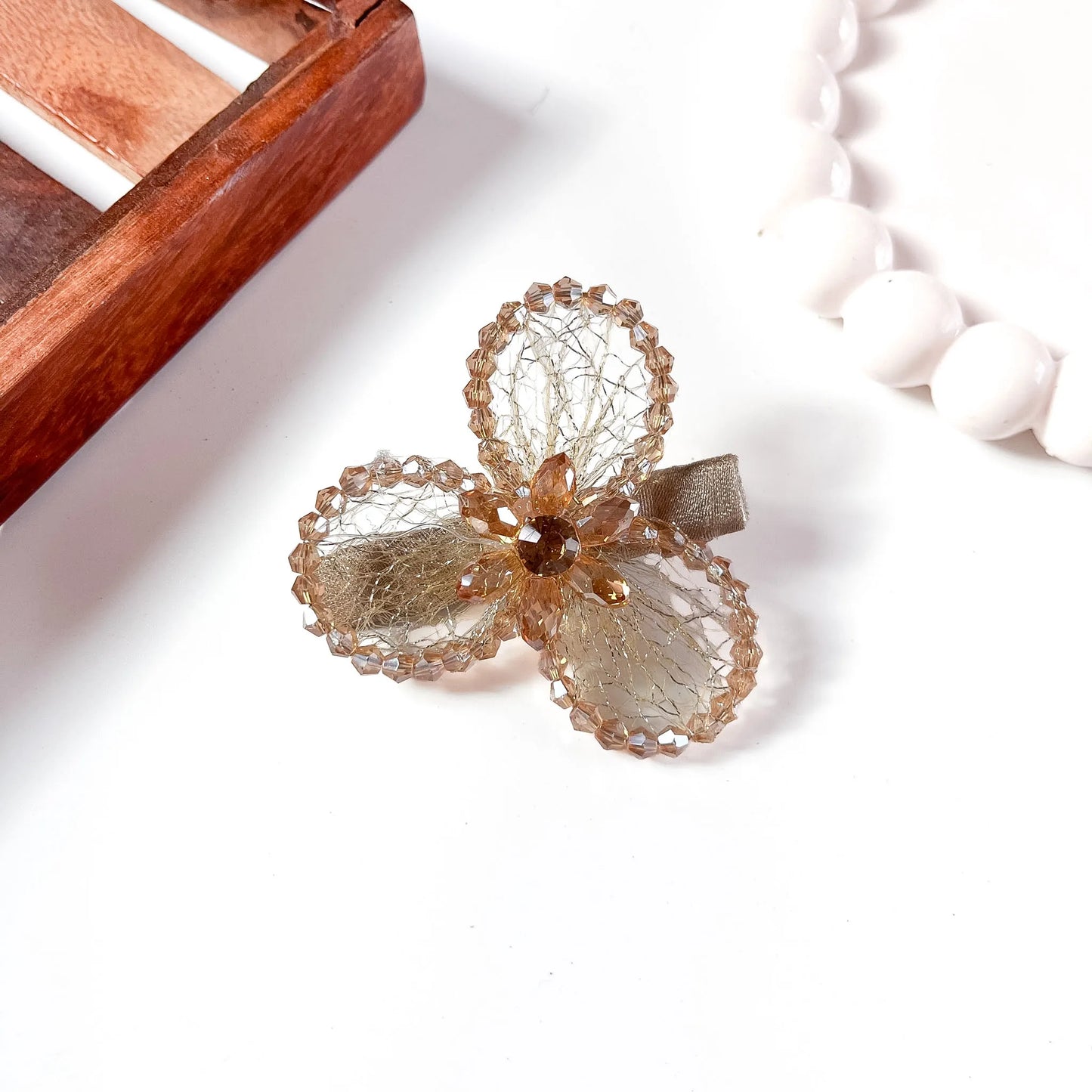 Bronze/champagne gold mesh alligator clip with three crystal petal spheres
