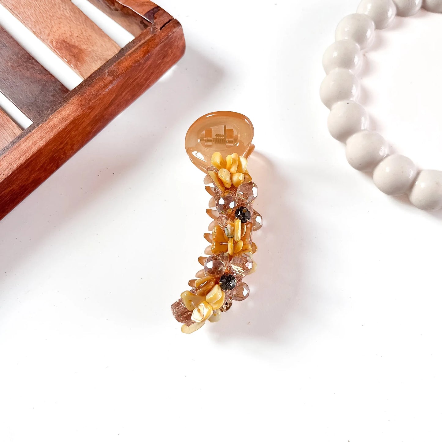 Golden amber glam chunk banana clip with warm honey-toned and champagne faceted gemstone chunks throughout.