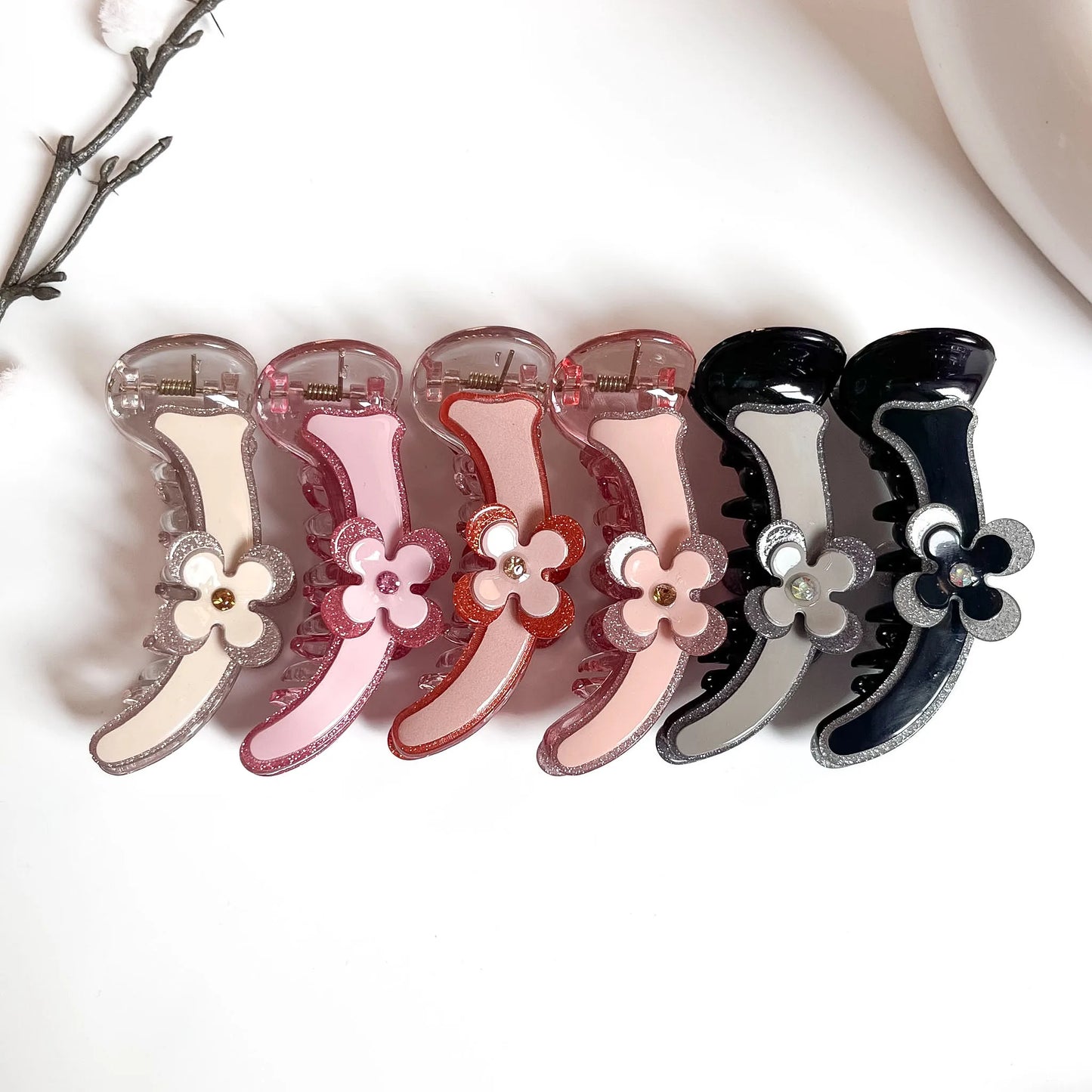 Glitter edge floral banana clips in nude, hot pink, red, blush pink, black white and dark grey with rhinestone flower centre