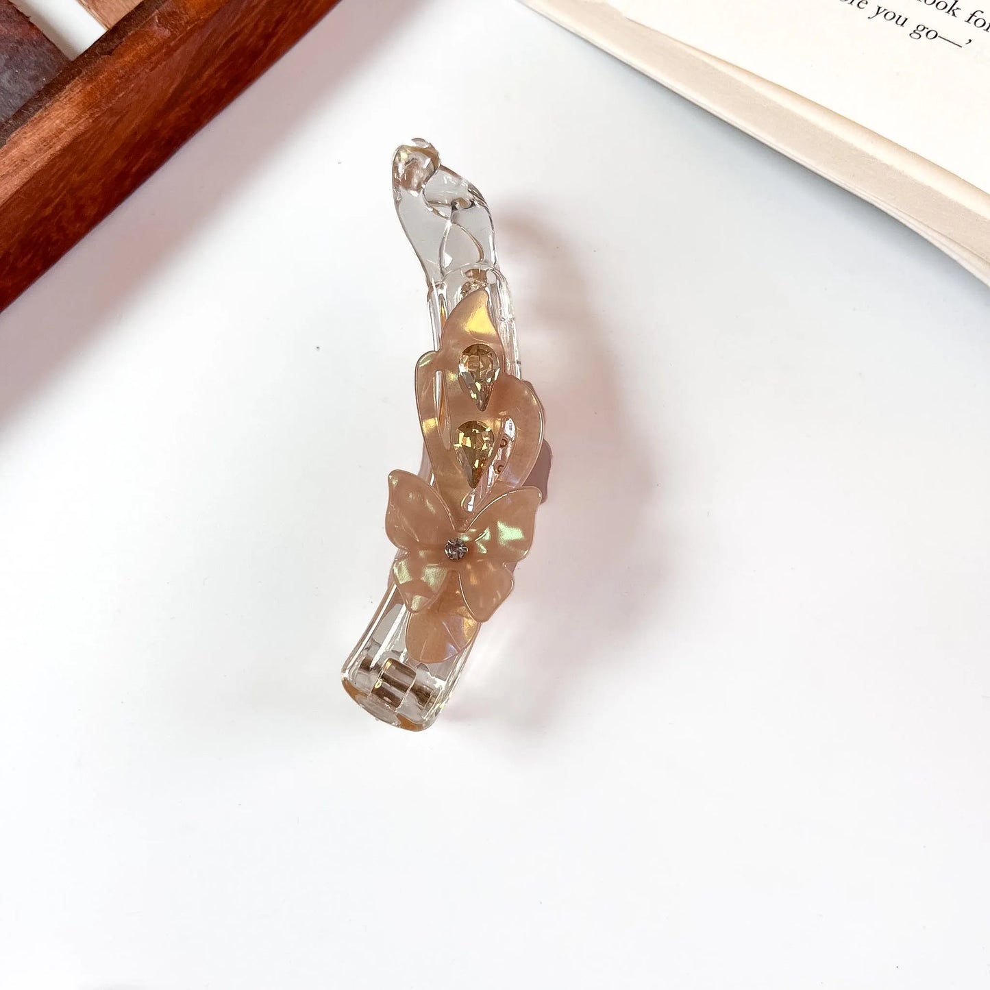 Taupe iridescent lock banana clip with flower and crystal detail