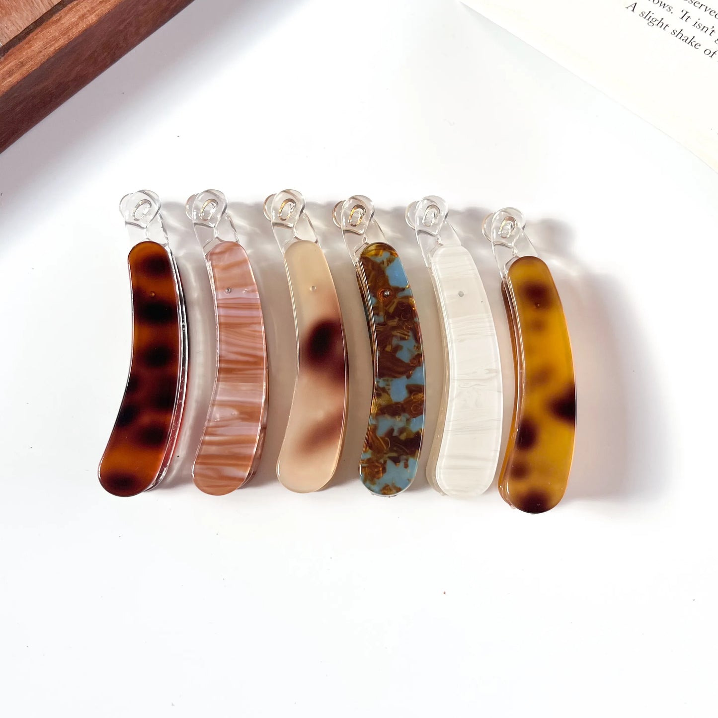 Set of six tortoiseshell banana clips on a white background