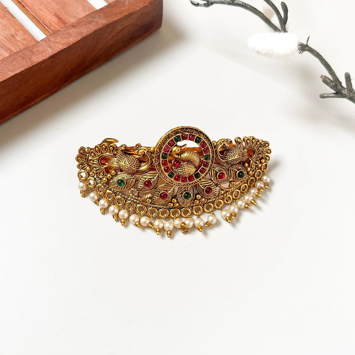 Antique gold peacock centre clip with red and green kemp ring and pearl drop fringe