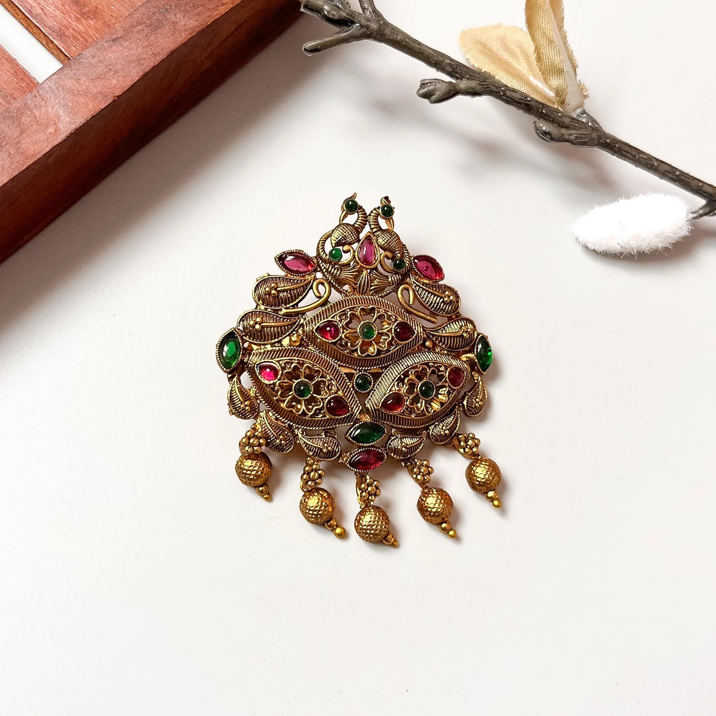 Traditional peacock brooch clip with mixed ruby and emerald stones, antique gold finish
