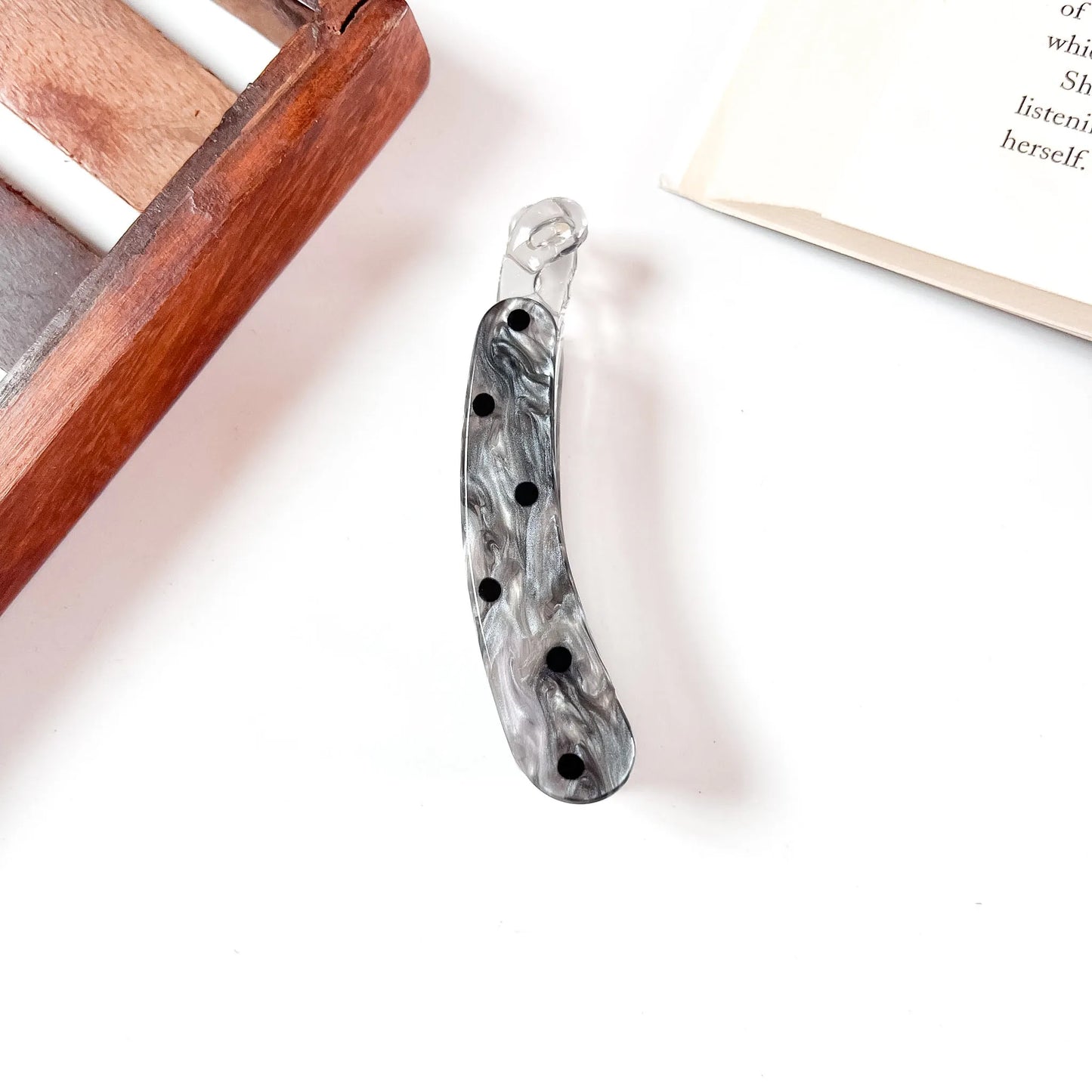 Charcoal marbled snap clip with black polka dots