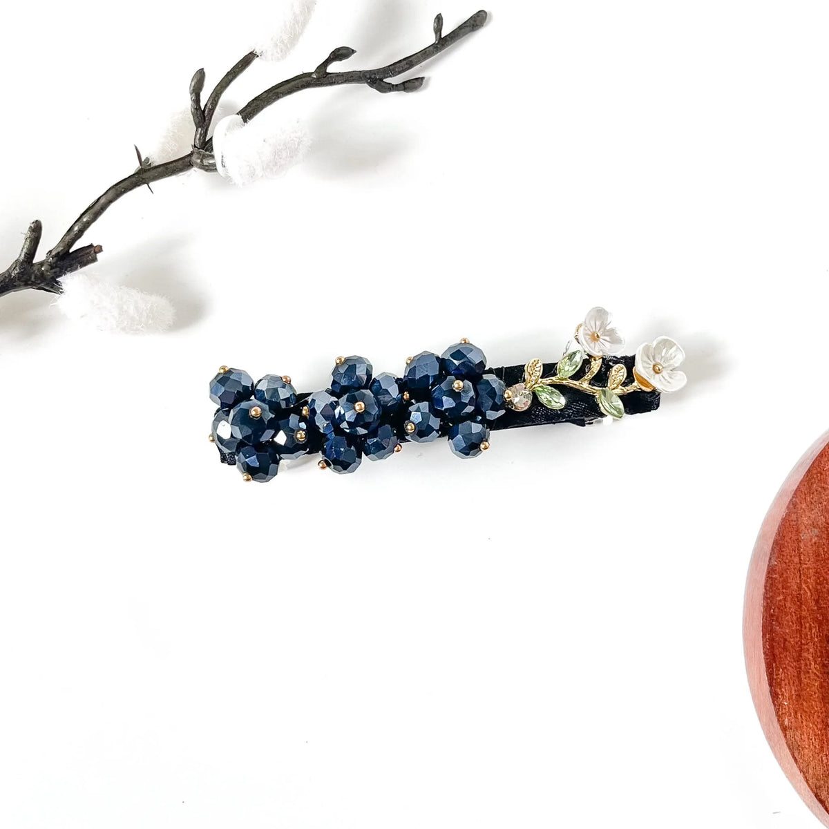 Sapphire navy blue beaded hair clip on black velvet with white shell flowers, a classy blue hair barrette