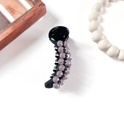 Deep black dome bead banana clip with smoky-toned faceted dome beads and high-gloss polished finish.
