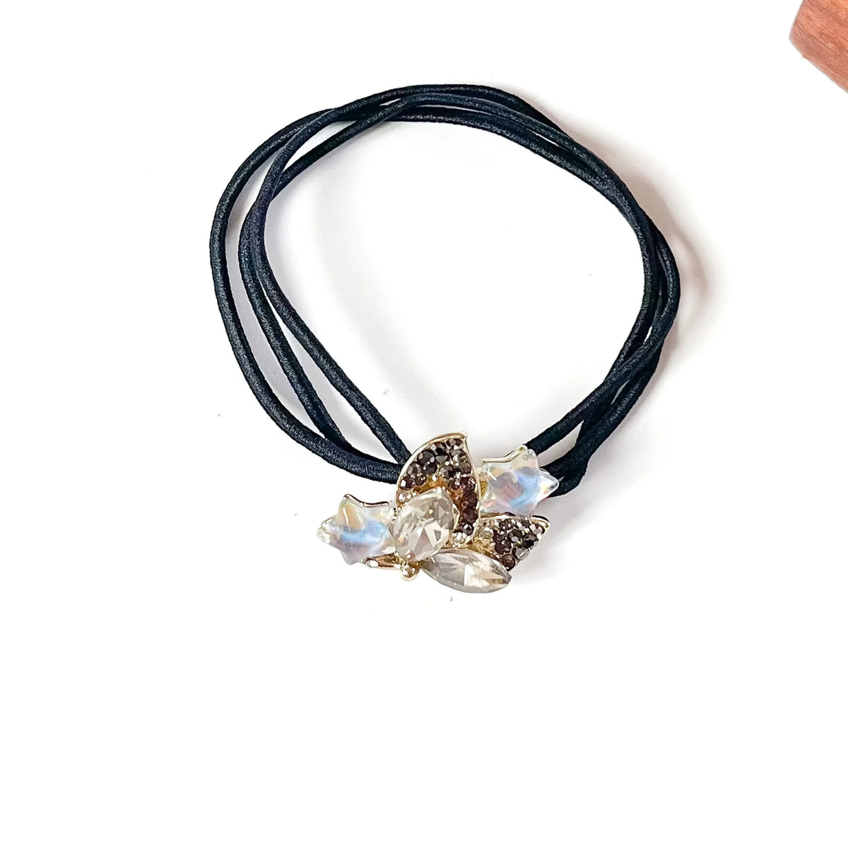 Ash grey fancy hair rubber band with smoky crystals, grey rhinestone leaves and iridescent stars