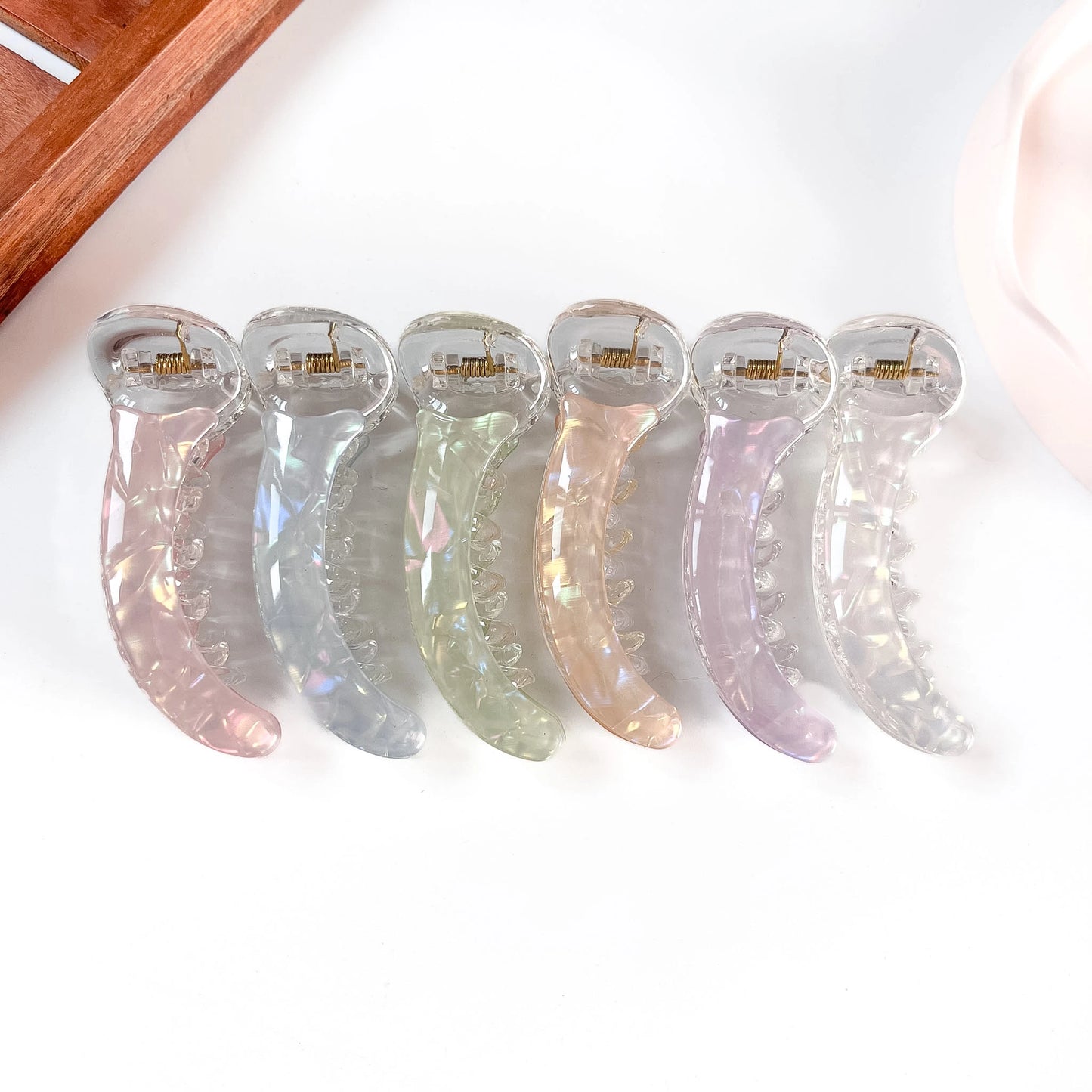 Aurora iridescent banana clips in pink, blue grey, sage green, champagne, lilac and clear for thick and curly hair