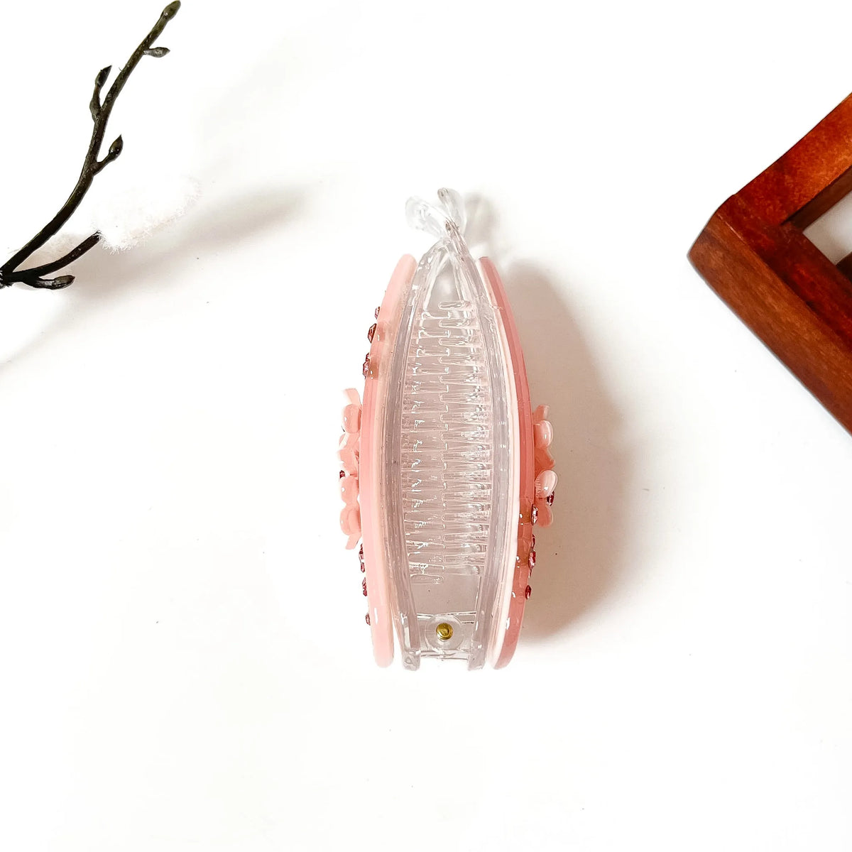 Blush pink teardrop banana clip with scattered rose rhinestones and white flower center, large size for thick hair