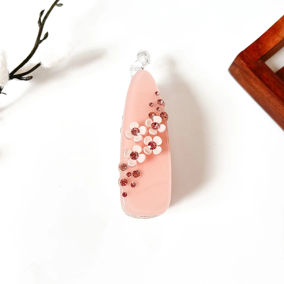 Blush pink teardrop banana clip with scattered pink rhinestones and white flower center, large size for thick hair