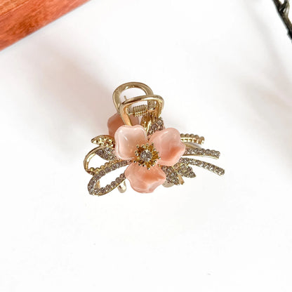 Peach botanical metal claw clip with dimensional acrylic petals, medium luxury clip