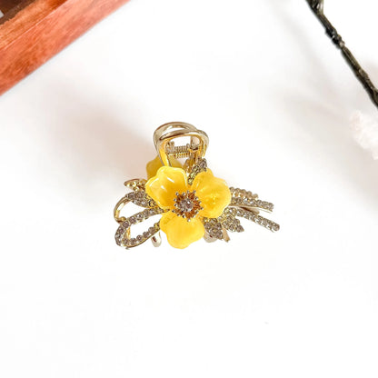 Yellow botanical metal clip with large flower bloom and gold-tone metalwork, medium size
