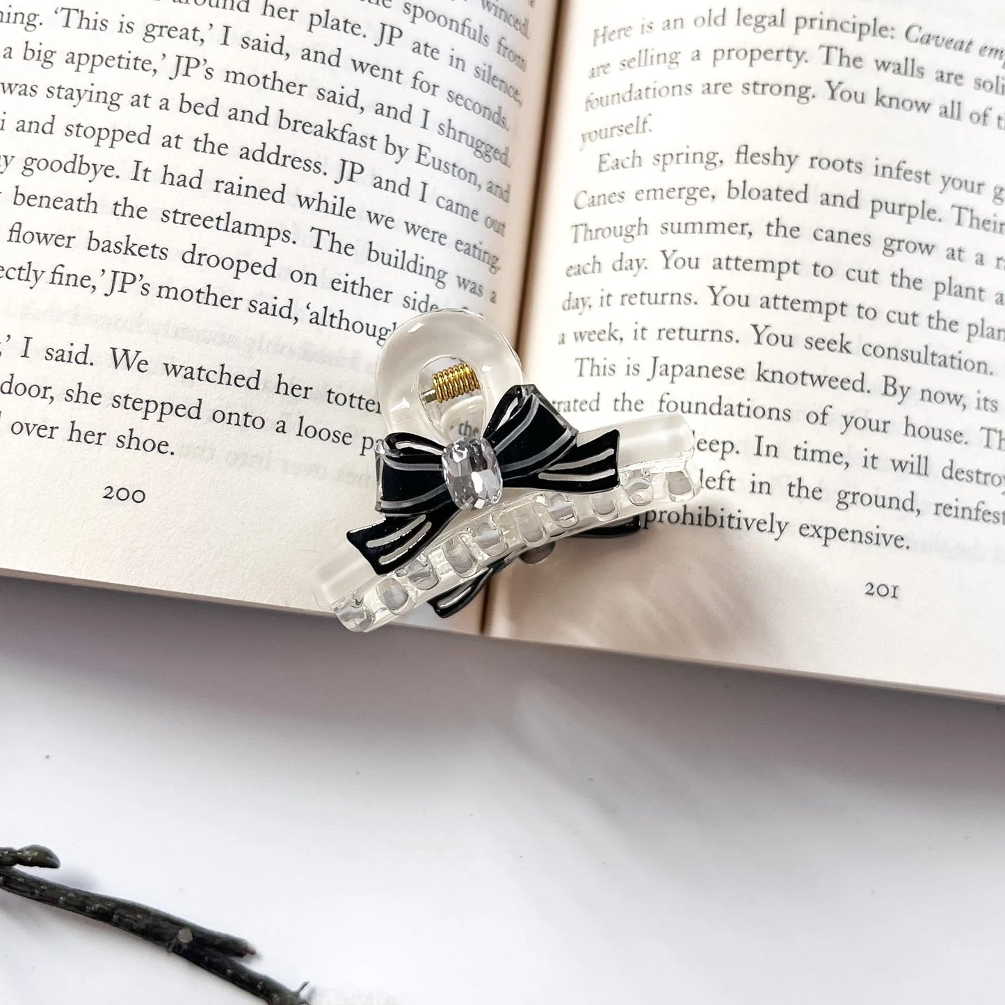 Black and clear bow hair claw clip with crystal detail