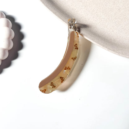 Bow print lock banana clip caramel nude with brown bow print