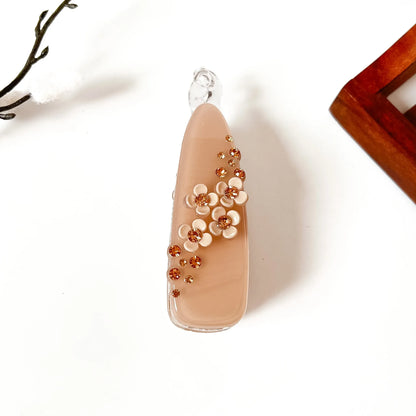 Brown Beige scattered gem banana hair clip with amber rhinestones and flower detail, large teardrop shape