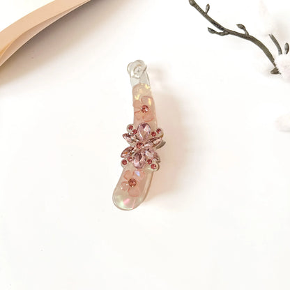 Dusty mauve banana hair clip with rose-gold rhinestone bloom