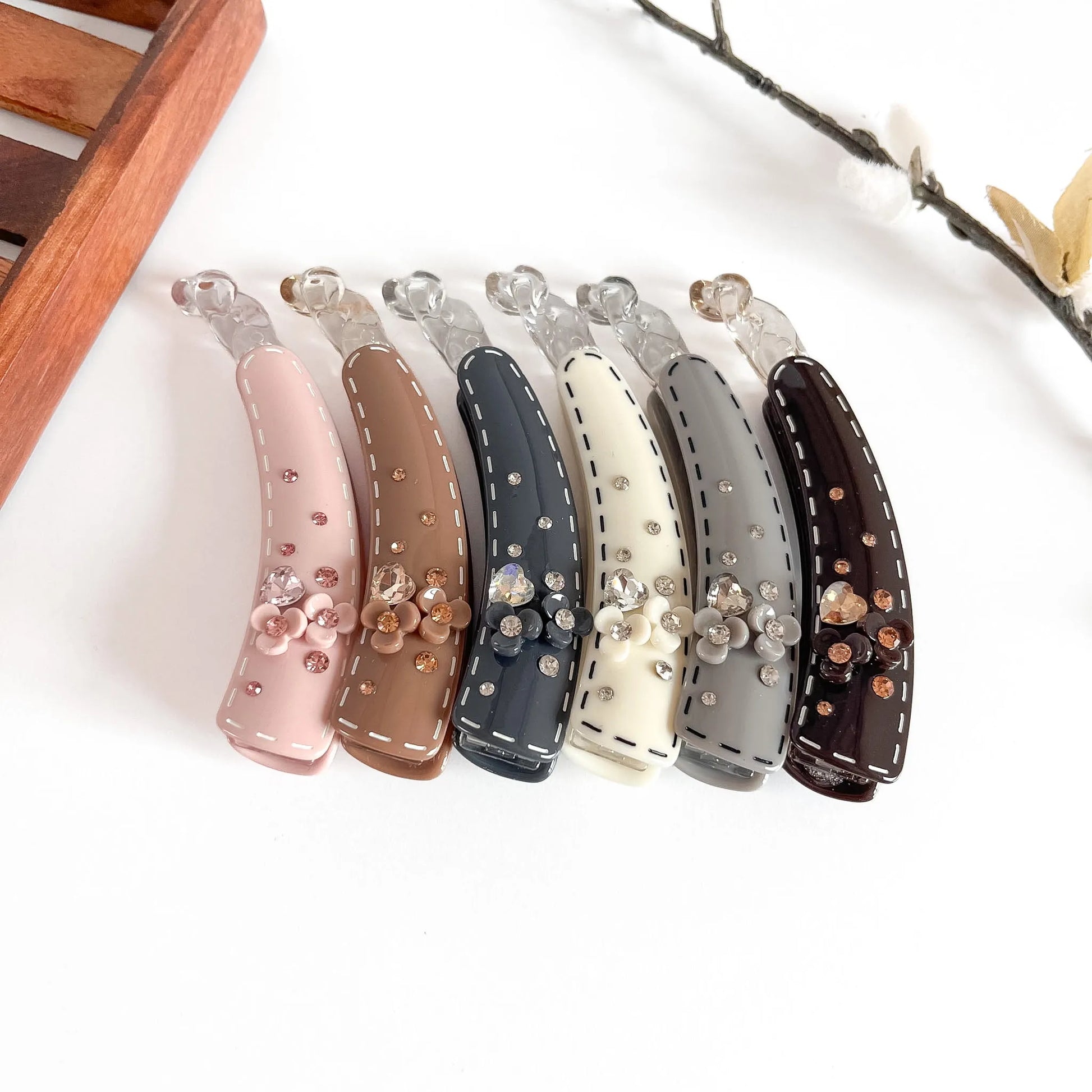 All 6 celestial lock banana clip shades: blush, caramel, charcoal, cream, graphite, burgundy embellished clips