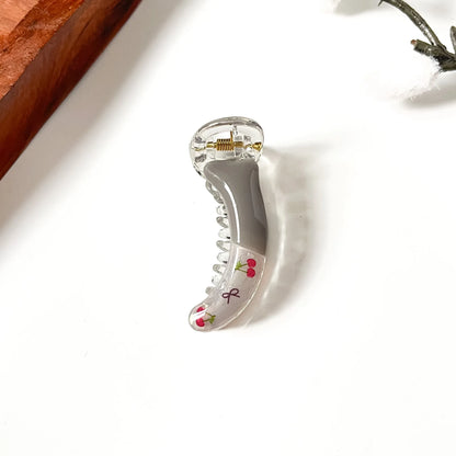 Silver grey handle cherry whisper clip with transparent acrylic cherry bow print, playful hair accessory