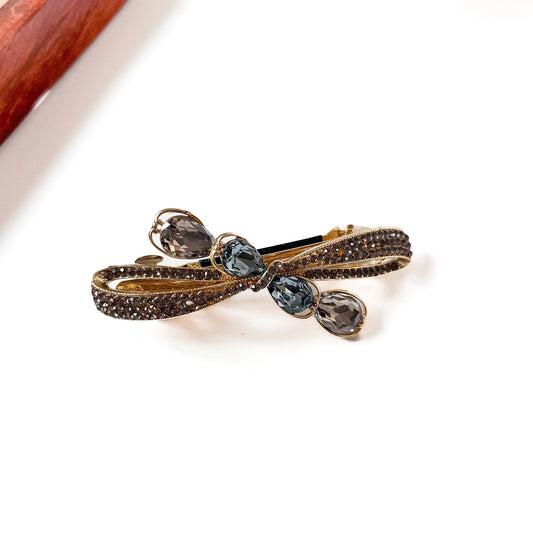 Crystal bow centre clip in smoky gold with pave rhinestones and blue grey teardrop crystal drops