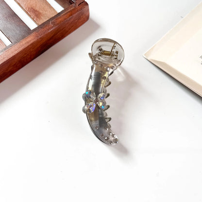Charcoal grey crystal banana clip with butterfly accent