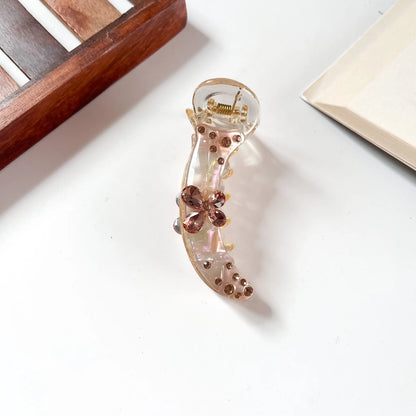 Peach gold crystal banana clip with butterfly centre