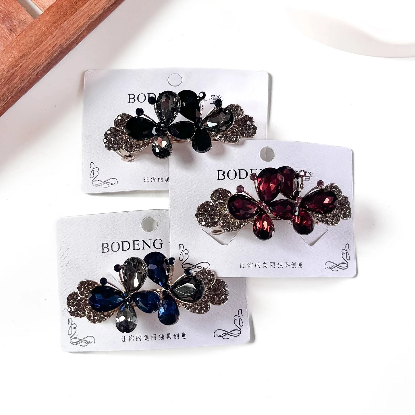 Crystal butterfly barrette in black wine and navy jewel shades