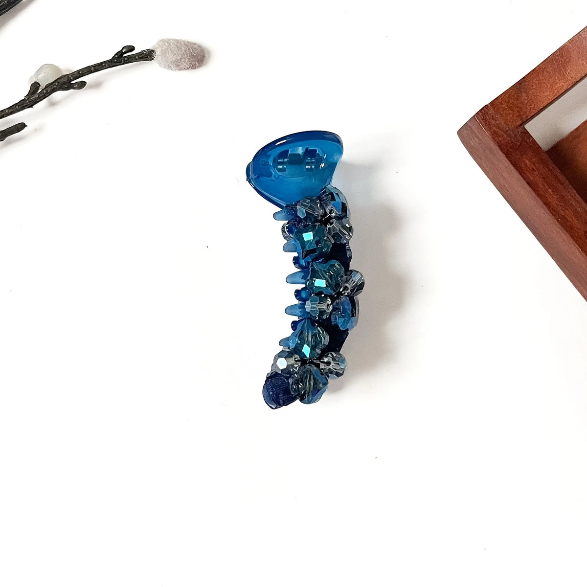 Sapphire blue designer banana clutcher with faceted crystals, 8cm