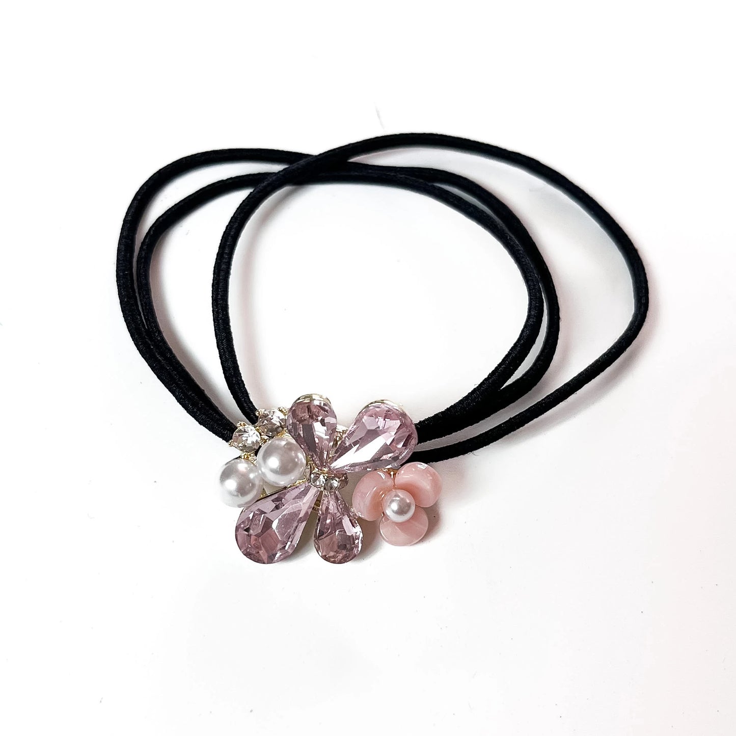 Blush pink crystal floral hair tie with pearl flower charm on black elastic band