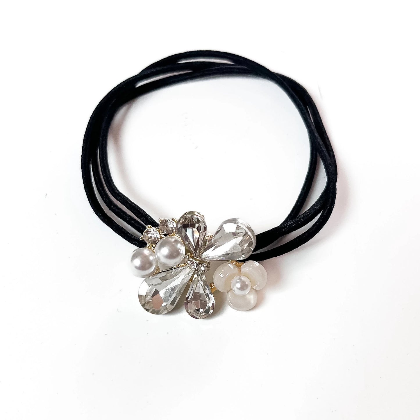 White crystal floral hair tie with white pearl charm on black elastic band