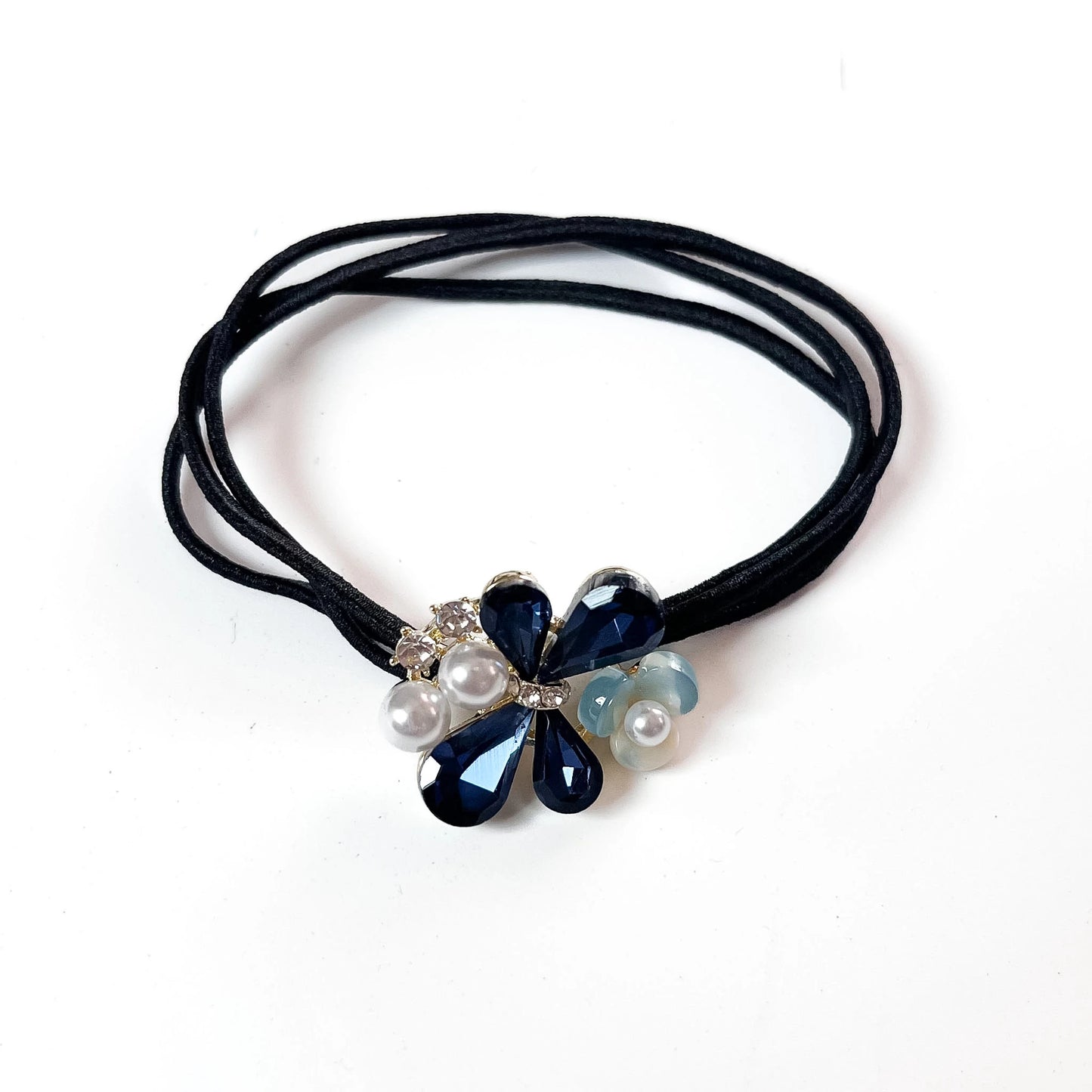 Navy blue crystal floral hair tie with pearl cluster charm on black elastic band