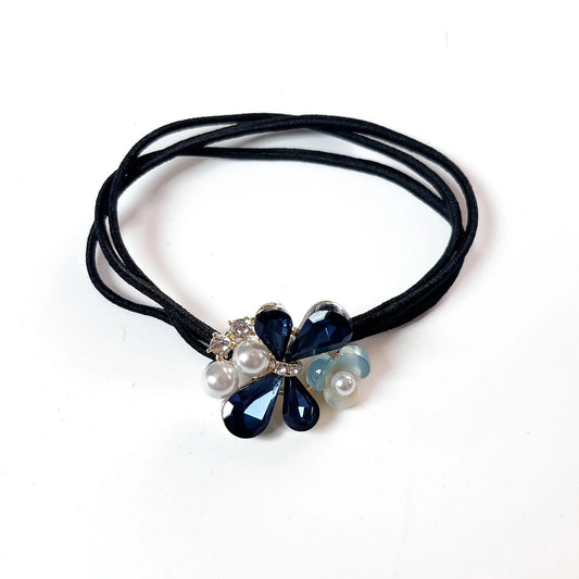 Navy blue crystal floral hair tie with pearl cluster charm on black elastic band