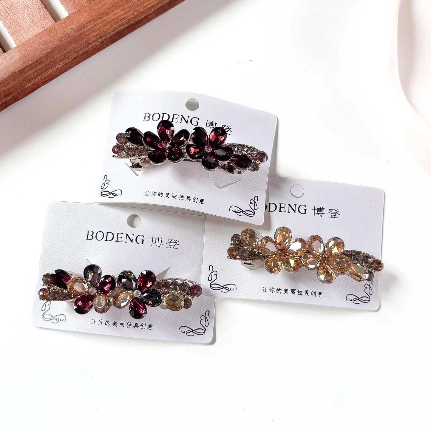 Crystal flower barrette in wine champagne and multicolour on snap base