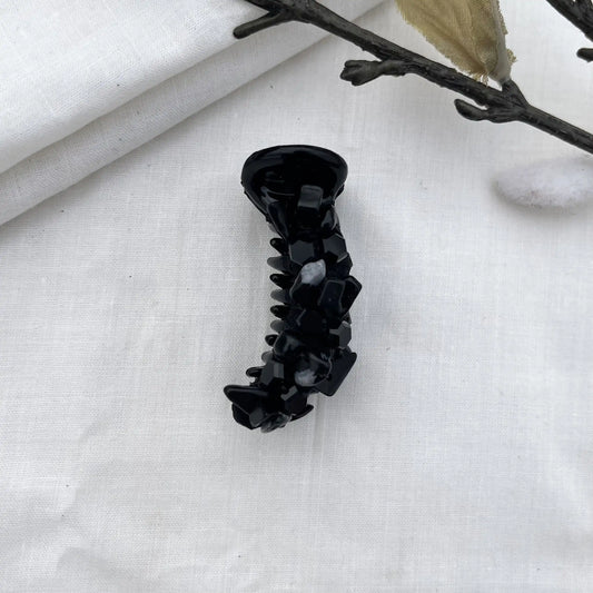 Black dainty mini banana clip with slim barrel and dark faceted bead embellishments in refined aesthetic.
