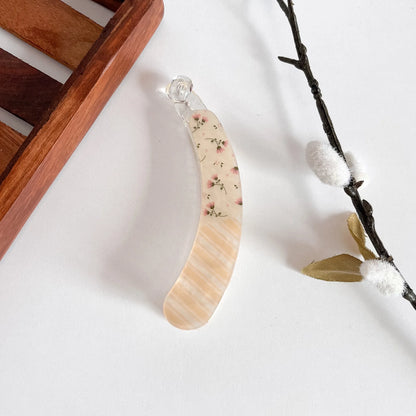 Peach pressed flower lock banana clip with delicate wildflowers, clear resin, 10cm