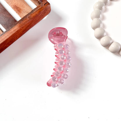 Vibrant hot pink dome bead banana clip featuring translucent faceted pink dome beads and glossy dome casing.