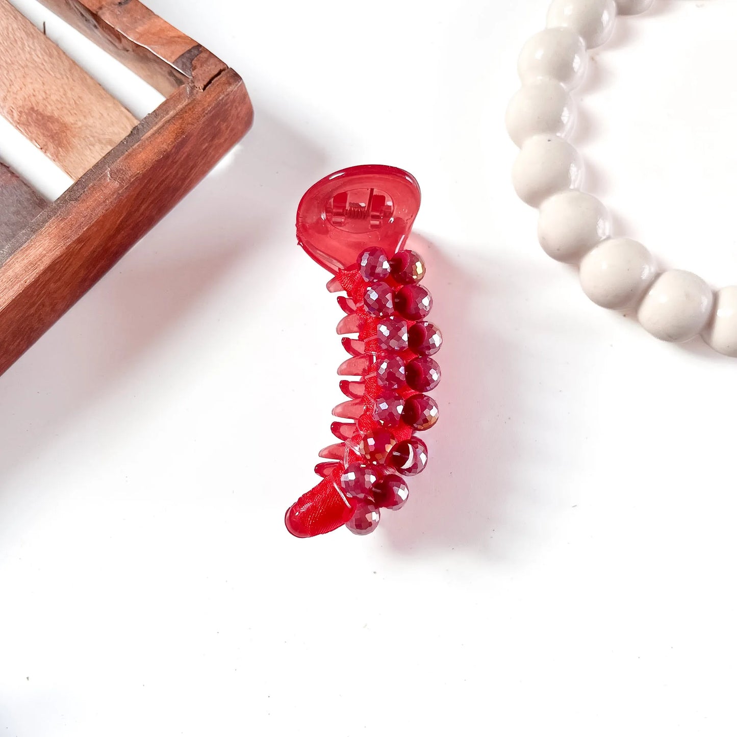 Cherry red compact dome bead banana clip with matching faceted red dome beads in cascading rows.