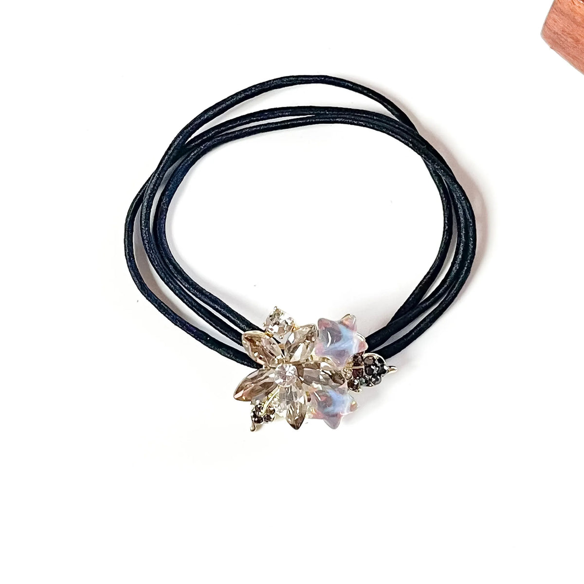 Dusk taupe crystal flower hair tie with smoky petals, lilac star charms and grey rhinestone leaves