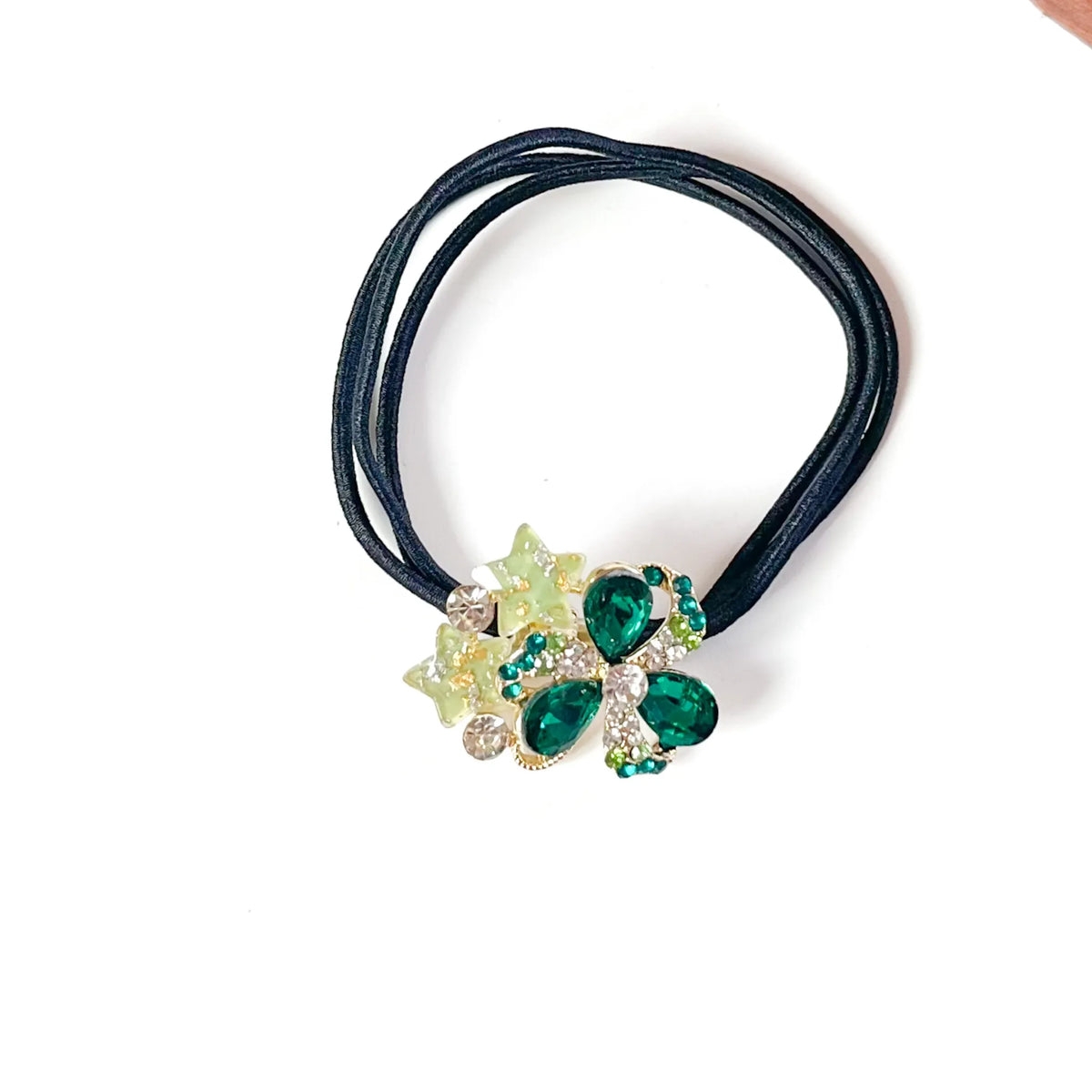 Emerald green fancy rubber band for hair with crystal clover and lime glitter stars on black elastic