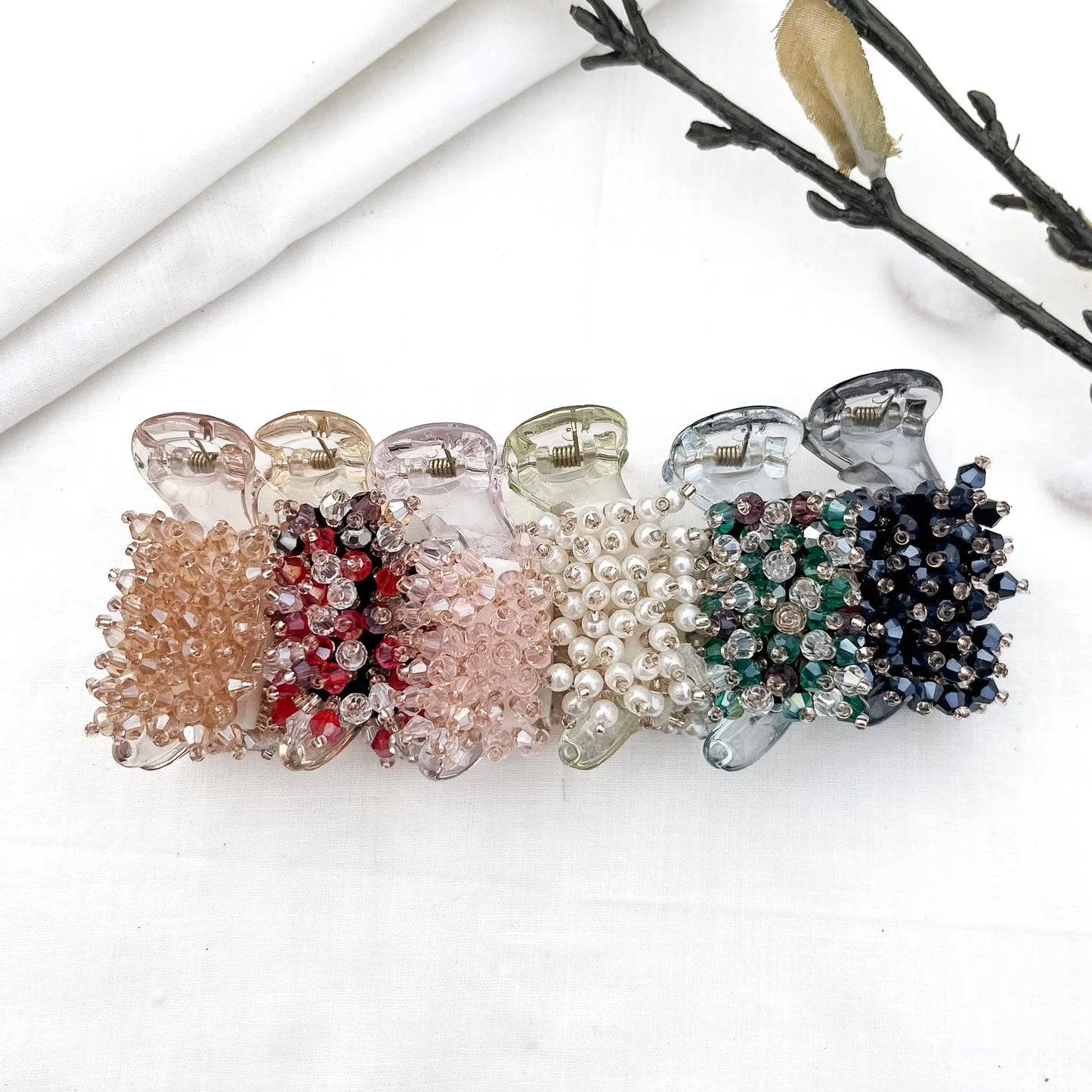 Color swatch: all 6 faceted bead cluster banana clip shades displayed in a row