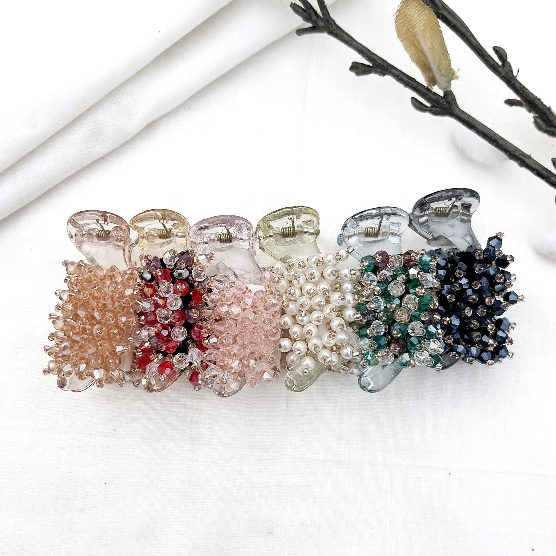 Color swatch: all 6 faceted bead cluster banana clip shades displayed in a row