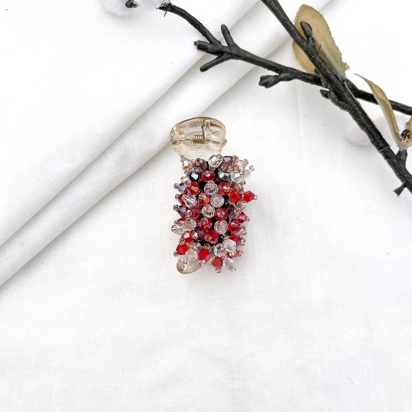 Red/burgundy 5cm banana clip with packed faceted bead cluster and crystal beads