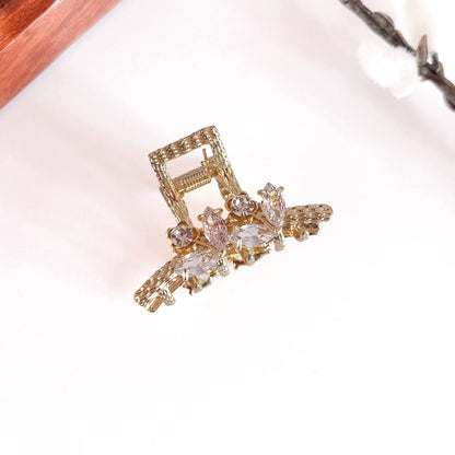 Clear crystal faceted gemstone metal clip with gold ornate base, small jeweled alligator clip