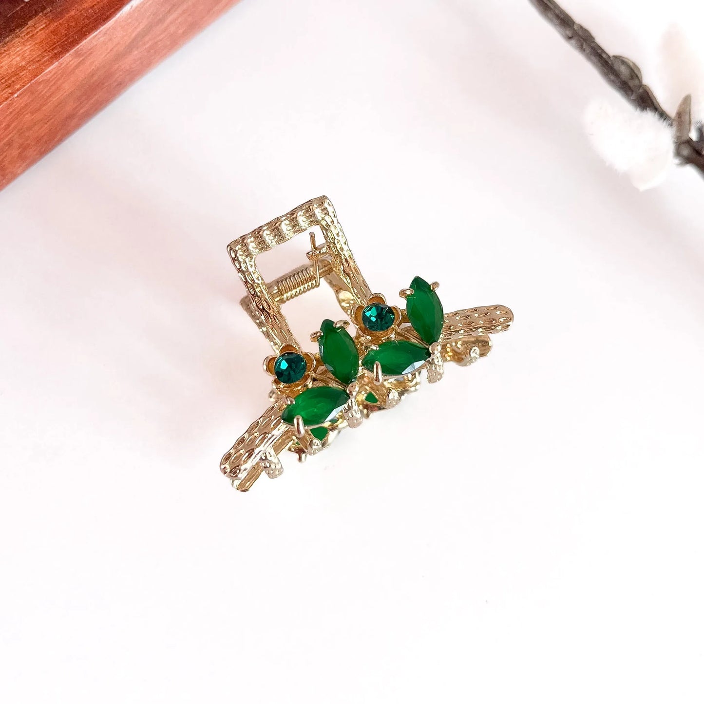 Emerald green faceted gemstone metal clip with gold base, small alligator hair clip with stones