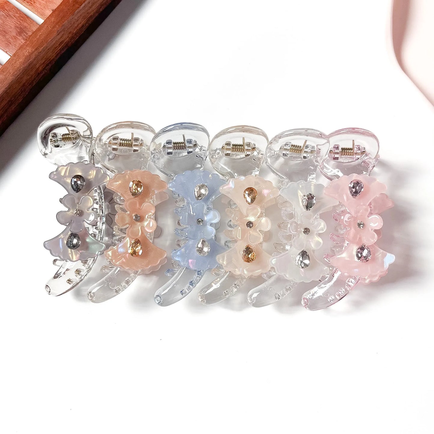 Floral crystal banana clips in grey, pink, white, nude peach, blue and salmon peach
