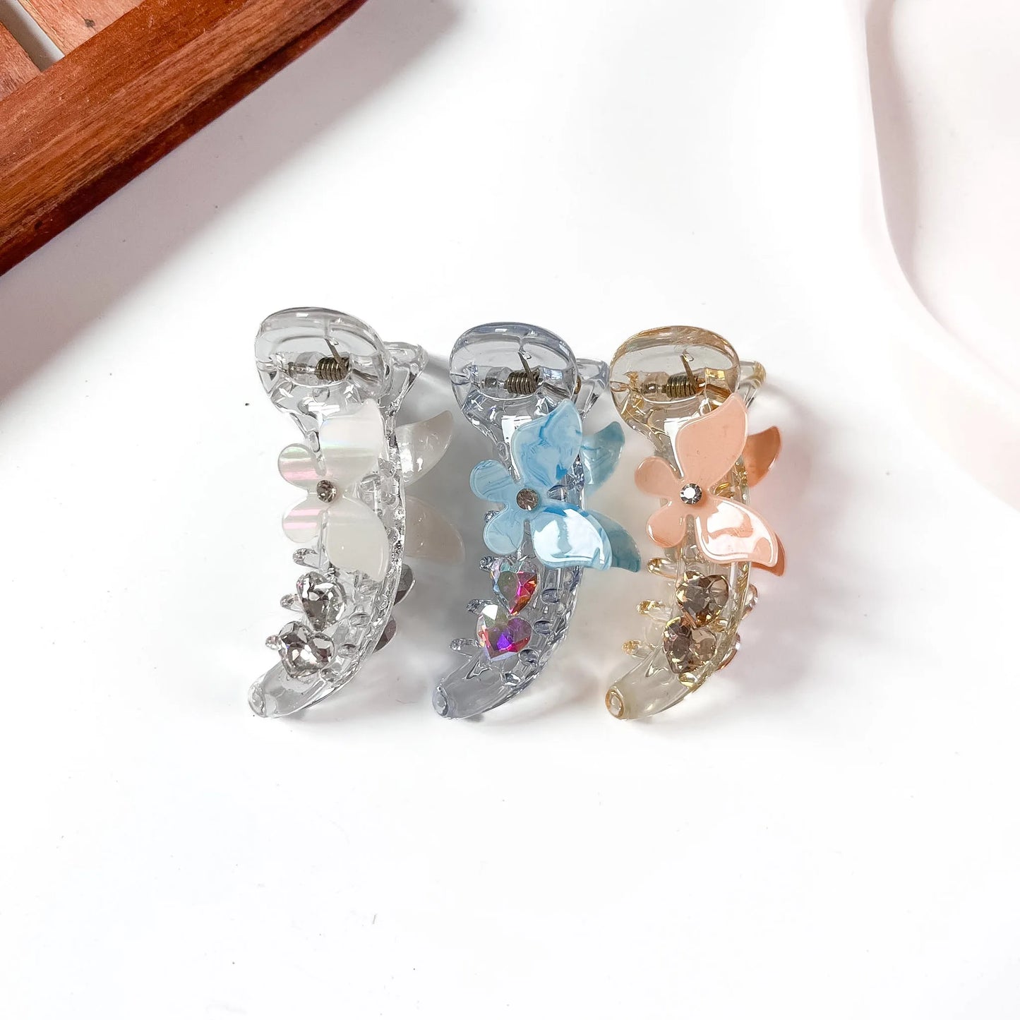 Flower butterfly charm mirchi banana clip in silver blue and peach with heart crystal drop