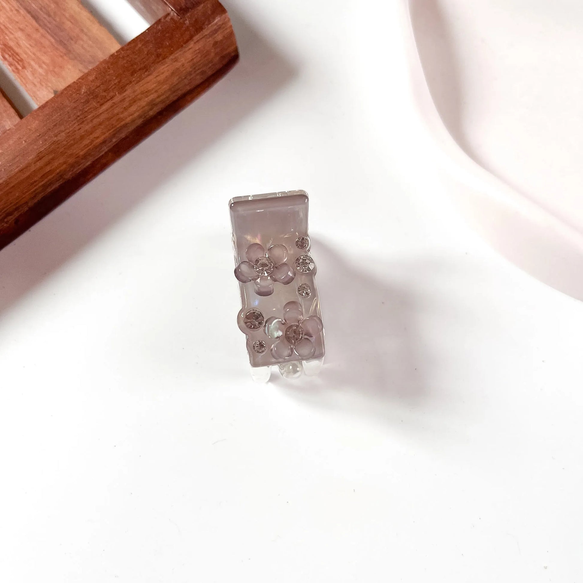 Grey flower crystal catch clip with rhinestone studs