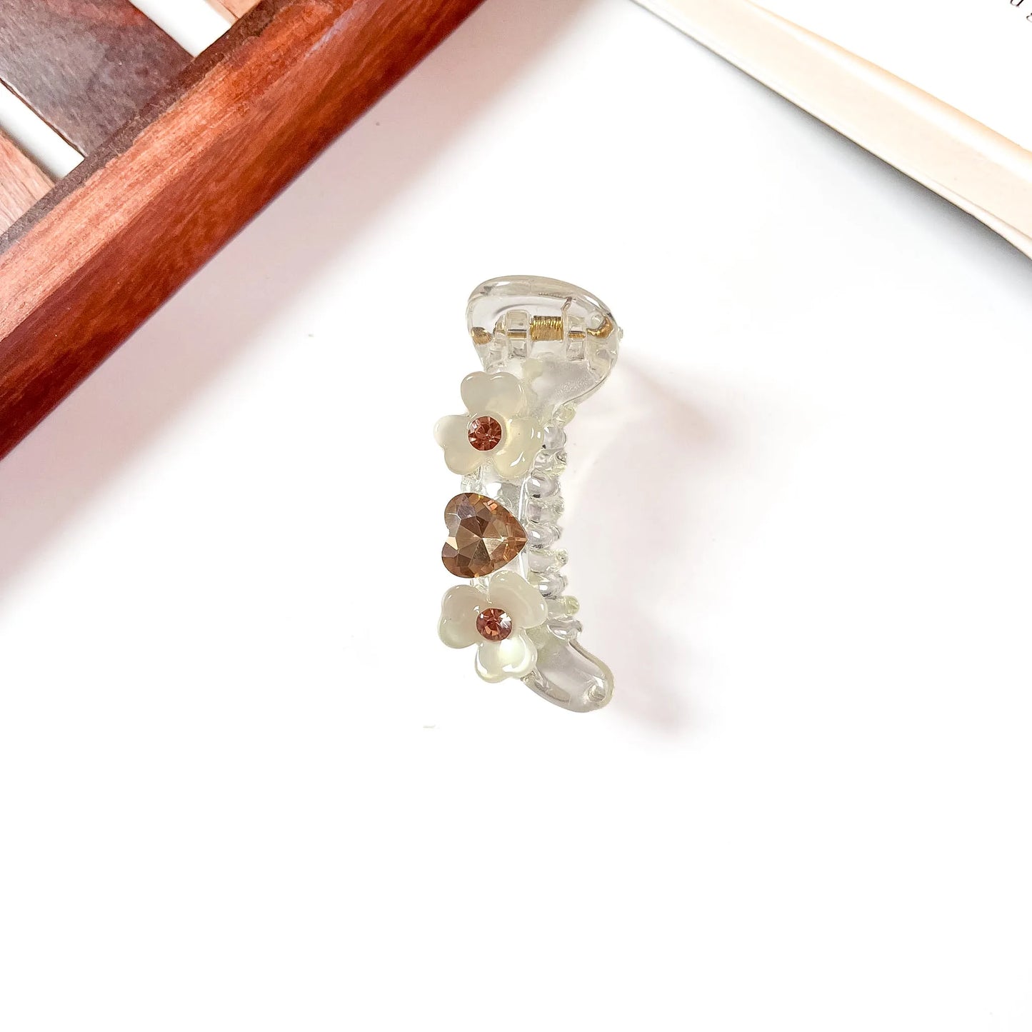 Cream translucent mini banana clip with small flowers and rhinestone gems, 6cm