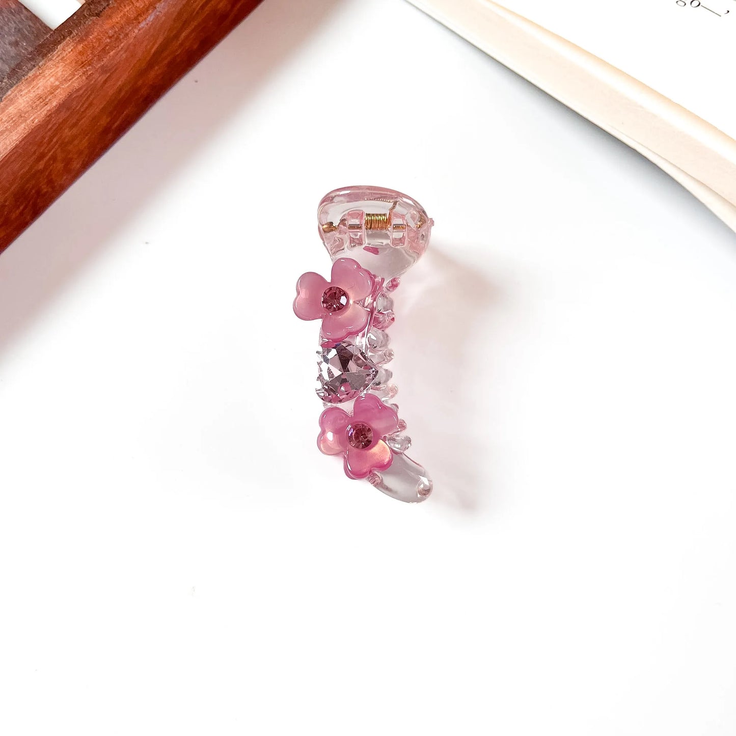 Hot pink mini banana clip with flower gems and rhinestone embellishments, 6cm